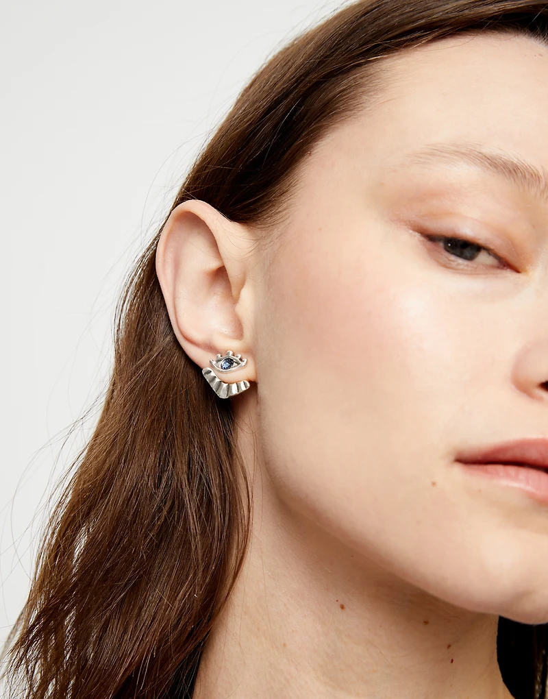 Eye-shaped stud earrings with blue crystal