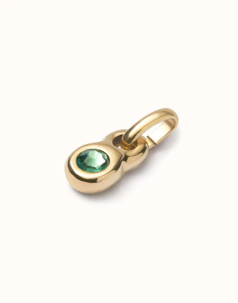 Charm with green crystal