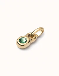 Charm with green crystal