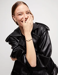 Black cord bracelet with a pearl