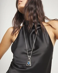 Long necklace with pendant and rectangular blue faceted crystal