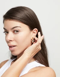 Drop earrings with a heart and black crystal