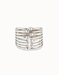 Bangle bracelet with multiple nail heads