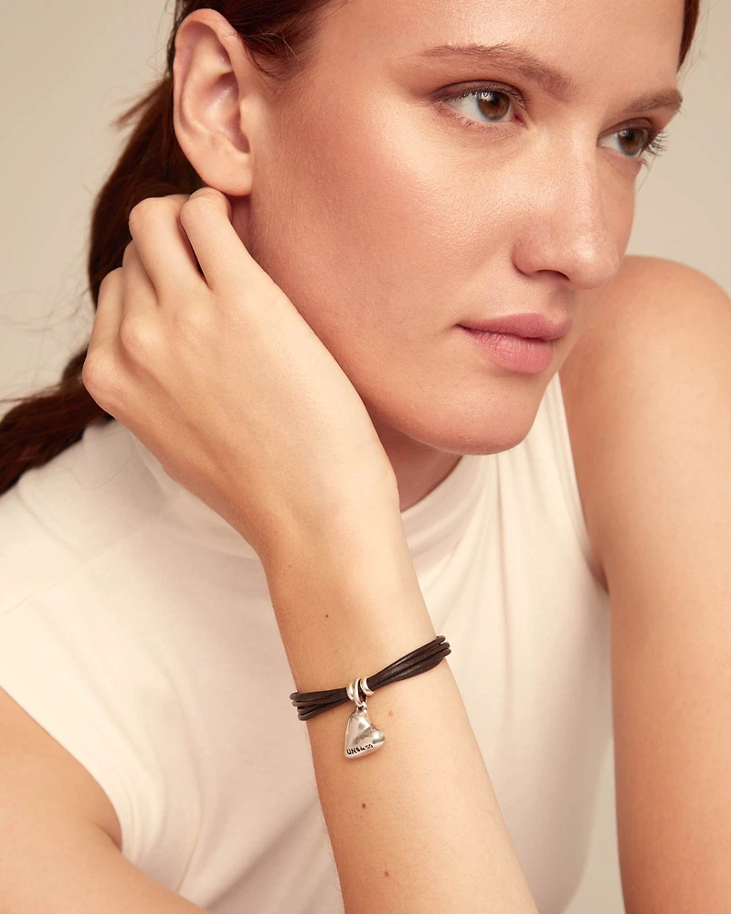 Leather bracelet with a heart charm