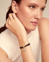Leather bracelet with a heart charm