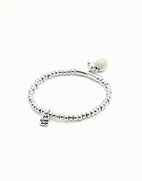 Beaded stretch bracelet with a murano glass and a horseshoe charm