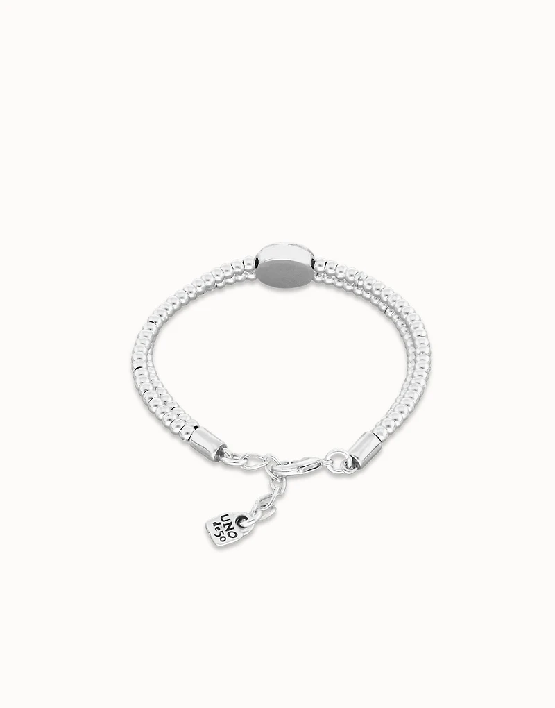 Two-strand beaded bracelet with an eye-shaped charm