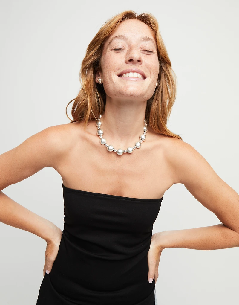 Beaded necklace with larger central bead