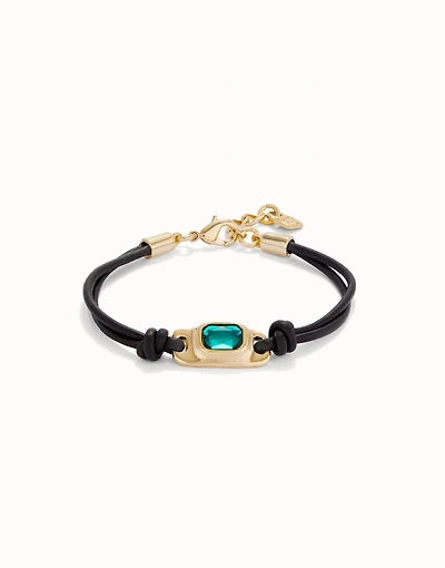 Leather bracelet with a green crystal