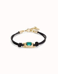 Leather bracelet with a green crystal