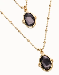 Multi strand necklace with two black oval faceted crystals