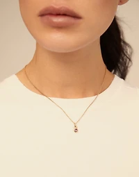 Round shaped Charm with a blue crystal