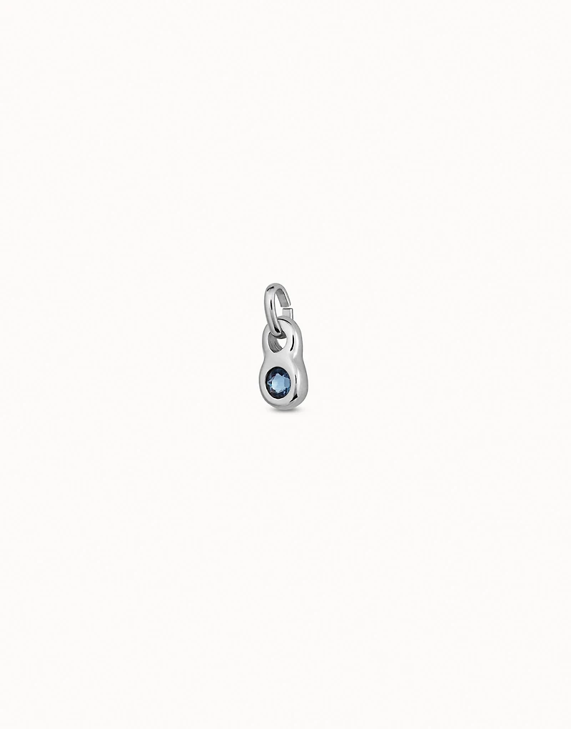 Round shaped Charm with a blue crystal
