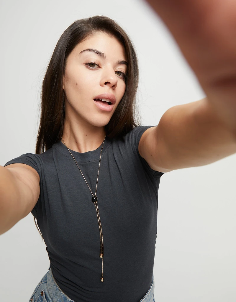 Long pendant necklace with central black murano glass