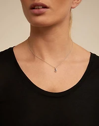 Round shaped Charm with a blue crystal
