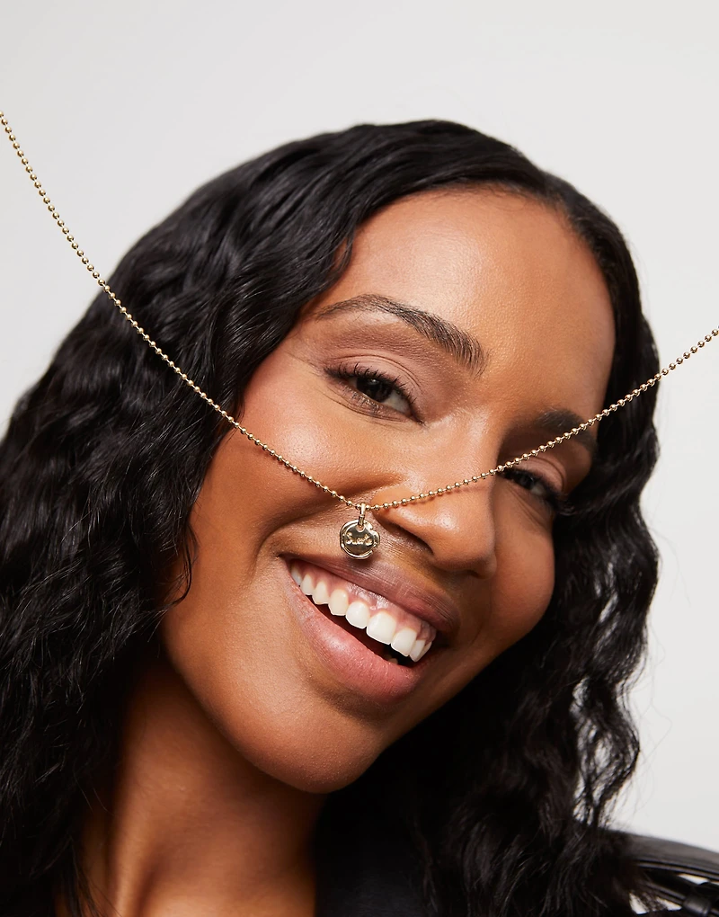 Charm with the word “luck