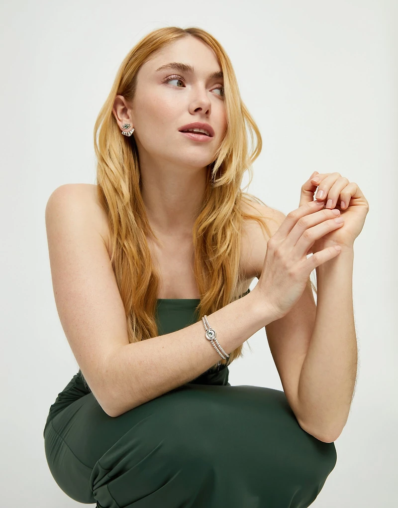 Two-strand beaded bracelet with an eye-shaped charm