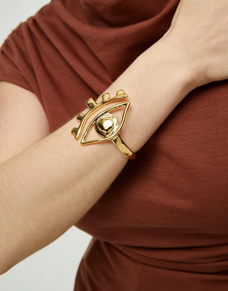Bangle bracelet with a striking central eye
