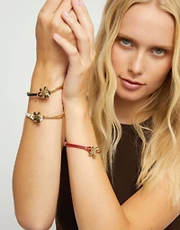 Cream leather bracelet with butterfly ornament