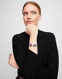 Bangle bracelet with two purple crystals