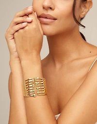 Bangle bracelet with multiple nail heads