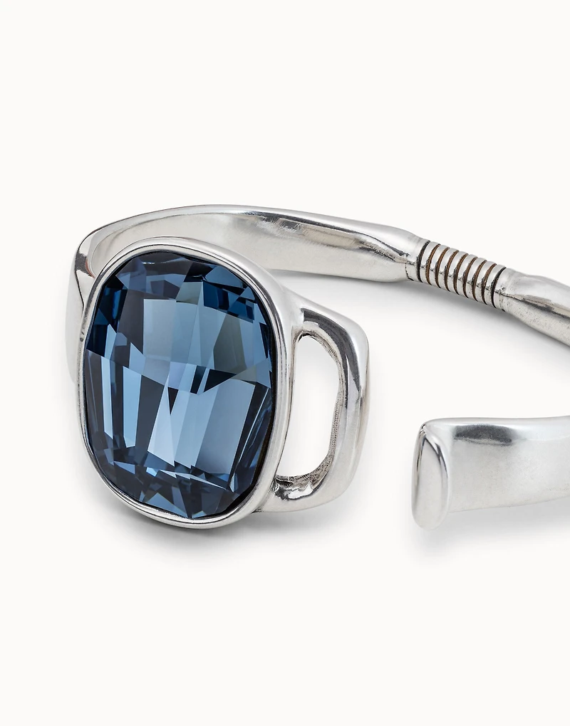 Bangle bracelet with a big blue crystal