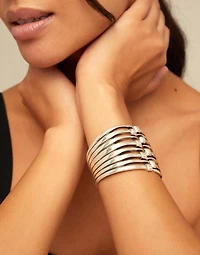 Bangle bracelet with multiple nail heads
