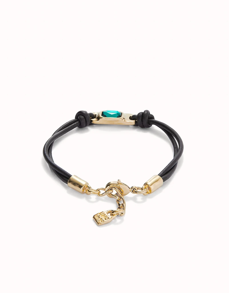 Leather bracelet with a green crystal