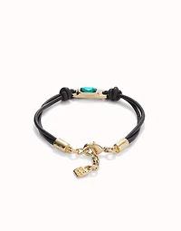 Leather bracelet with a green crystal