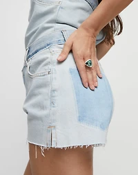 Triangular ring with green crystal