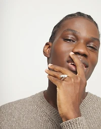 Ring with two intertwined organic forms