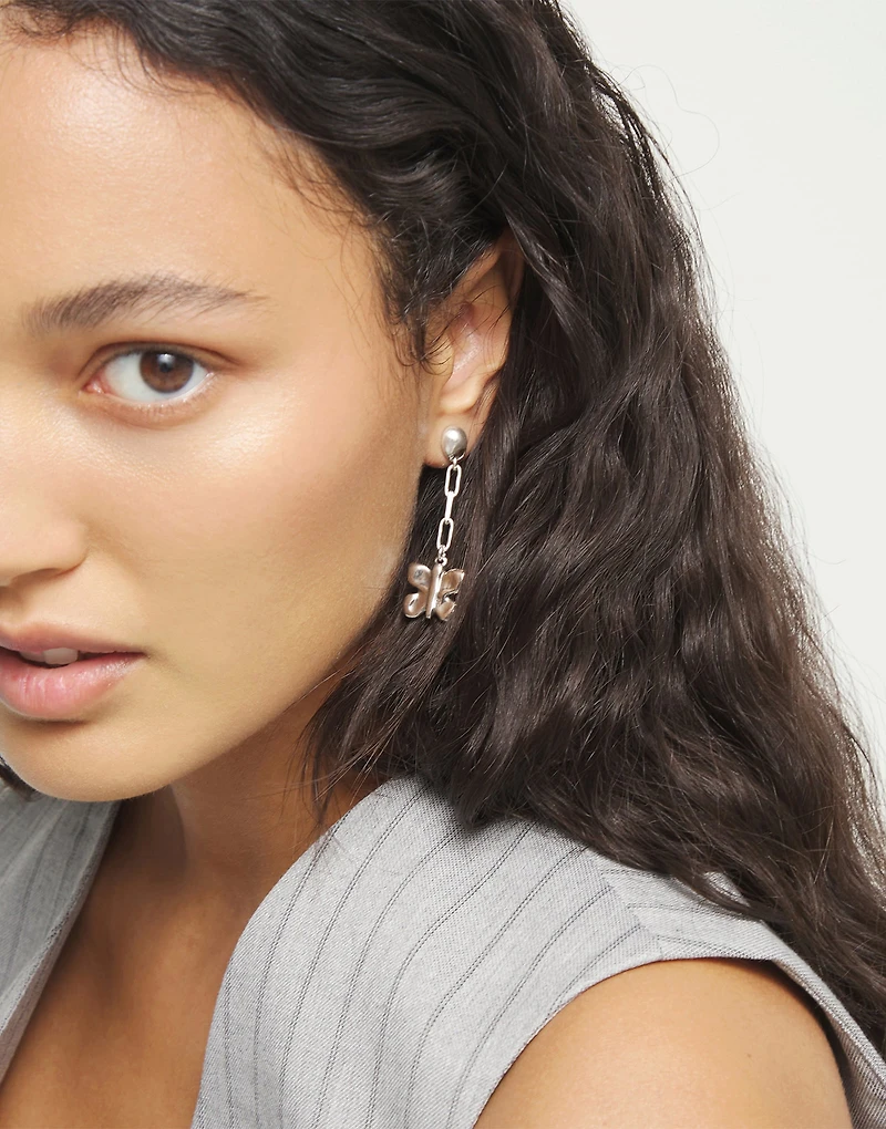 Drop earrings with a butterfly-shaped ornament