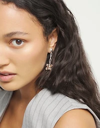 Drop earrings with a butterfly-shaped ornament