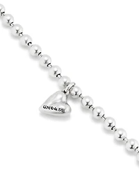 Beaded bracelet with a heart charm