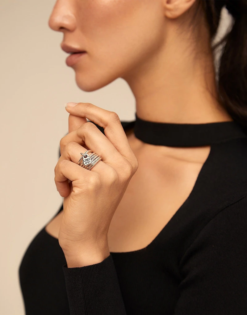 Multi row ring with a charm