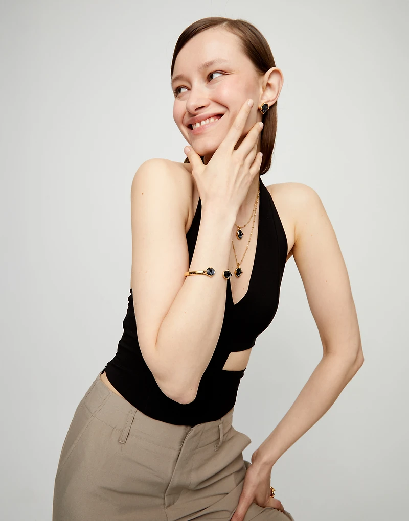 Bangle bracelet with two faceted black oval crystals