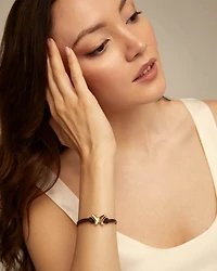 Double strand leather bracelet with a butterfly