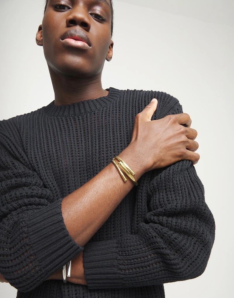 Bangle bracelet with three intertwined organic shapes