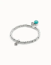 Beaded stretch bracelet with a murano glass and a hamsa
