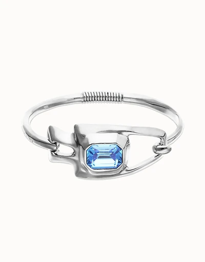 Semi-rigid bracelet with blue faceted crystal