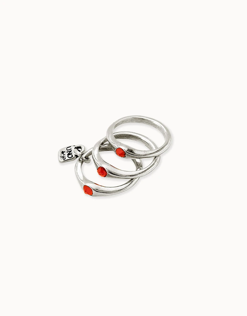 Triple ring with red crystals
