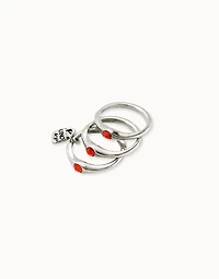 Triple ring with red crystals