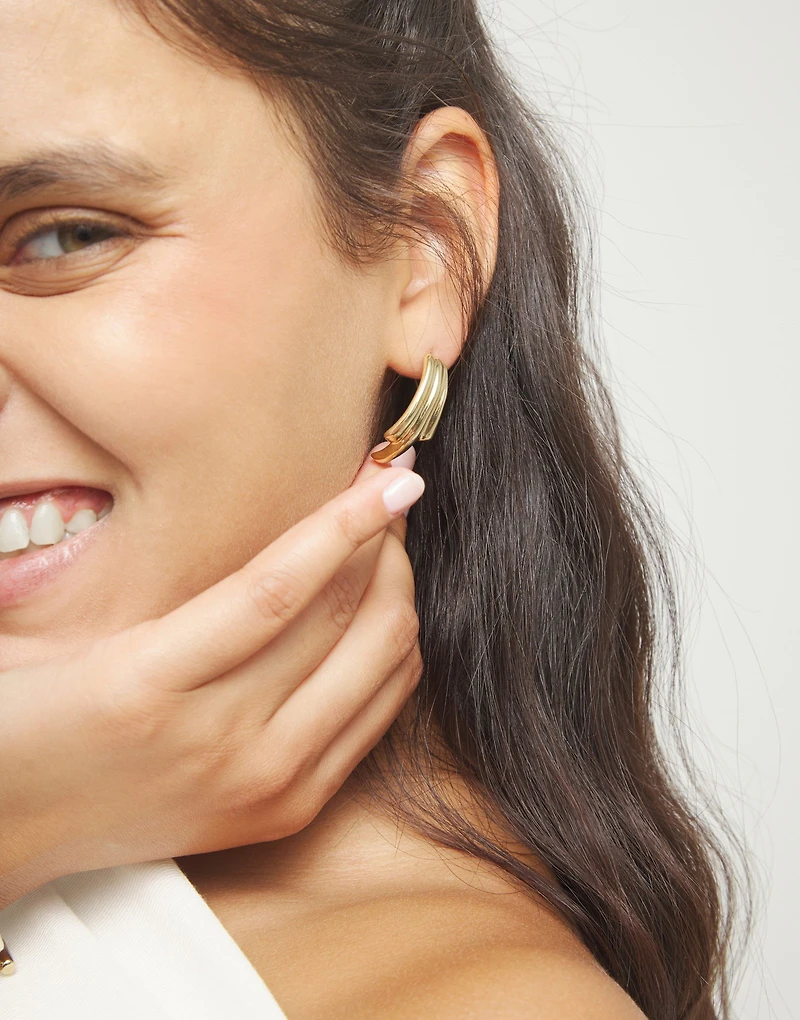 Stud earrings with elongated organic shapes