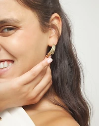 Stud earrings with elongated organic shapes