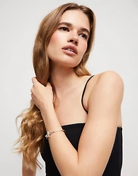 Pulsera con cierre frontal bañada en plata de ley con topacio blanco