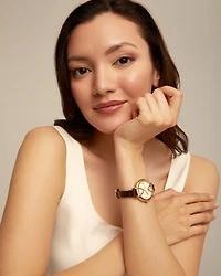 18K gold-plated watch with black leather strap and round white dial