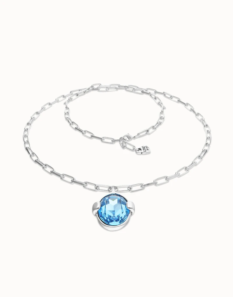 Long necklace with large blue oval faceted crystal