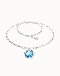Long necklace with large blue oval faceted crystal