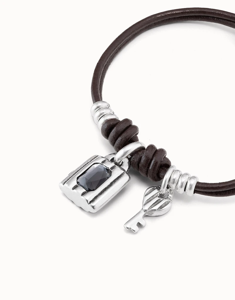 Sterling silver-plated bracelet with leather straps and padlock and key charms