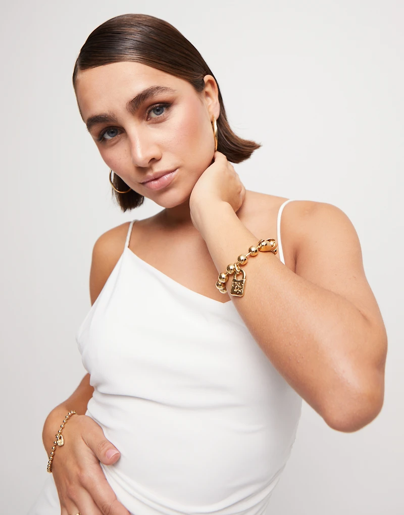 Beaded bracelet with a padlock charm